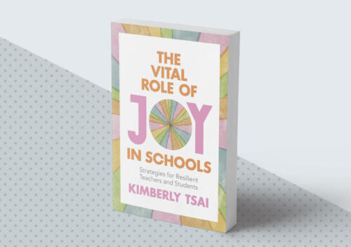 Book titled The Vital Role of Joy in Schools by Kimberly Tsai, with pastel geometric patterns and bold, colorful text on the cover, placed on a dotted surface.