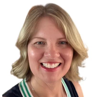 Smiling woman with shoulder-length blonde hair, wearing a dark top with white and green trim, in front of a white background.