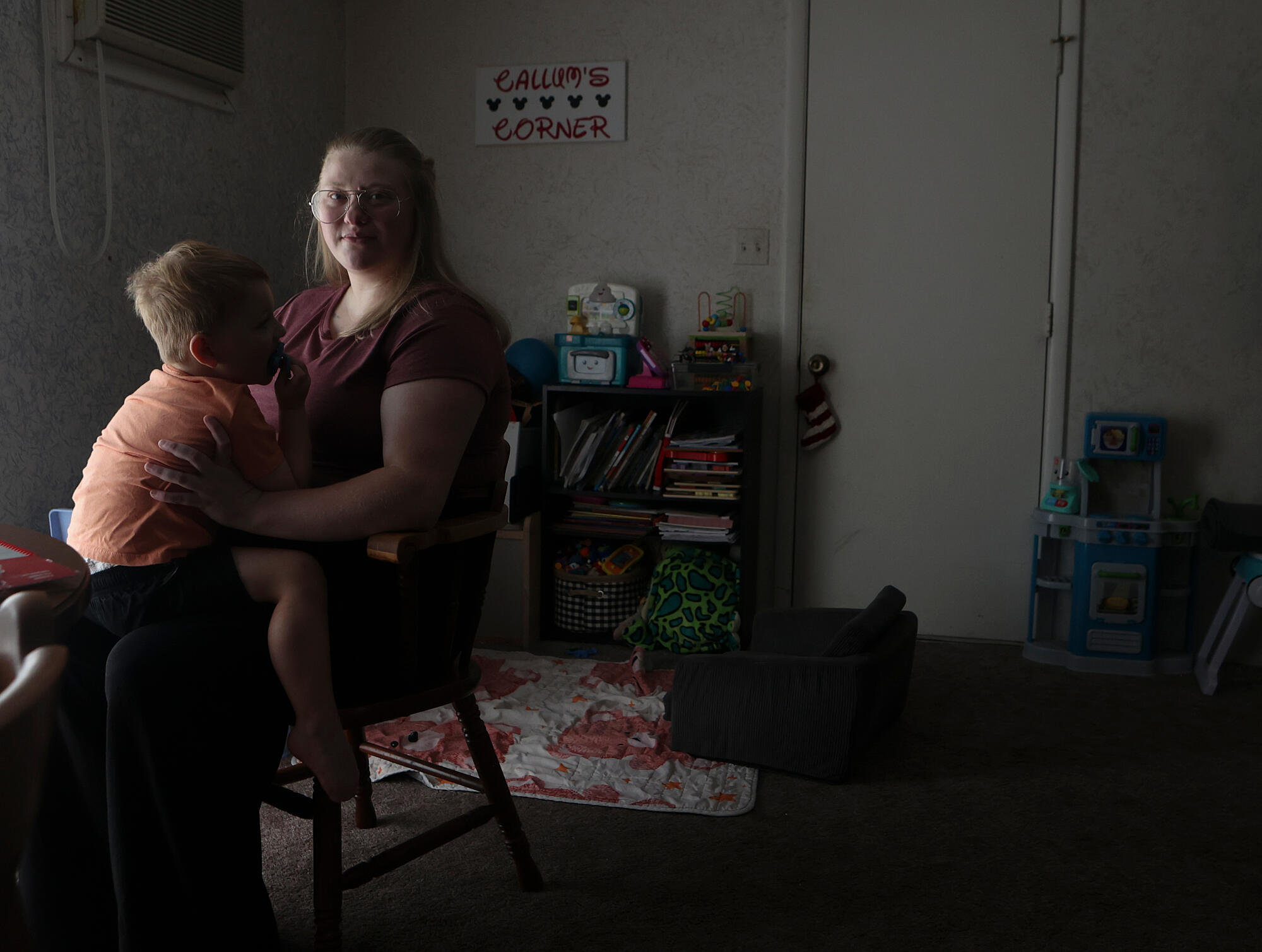 Meygan Maloney poses for a portrait with her son Callum Wilson, 3, Friday, Aug. 28, 2026, at their home in Hartford City, Ind. (AP Photo/Cara Penquite)